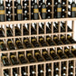 Close-up view of triple-tier wine rack showing bottle necks in wooden slots