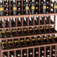 Wine bottle display rack detail with reddish-brown slats holding bottles on three tiers
