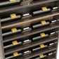 Horizontal wine bottle display rack end cap, close-up of dark shelf compartments