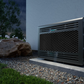Mini blow-through cooling unit installed outdoors on a stone base near a wall