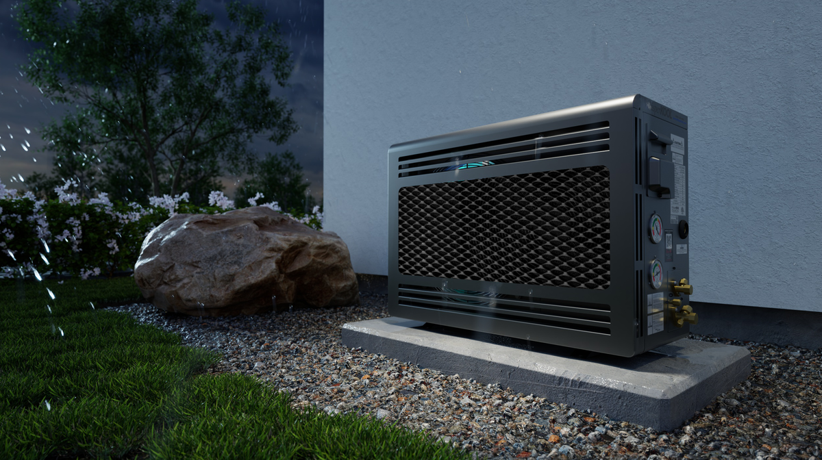 Mini blow-through cooling unit installed outdoors on a stone base near a wall